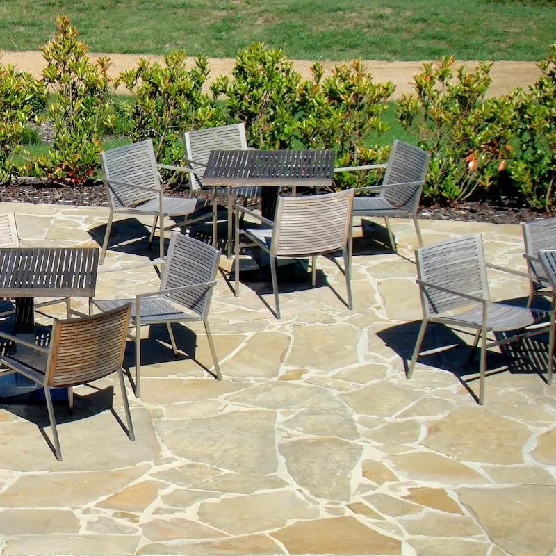 Tuscan Beige Limestone beige crazy paving across an outdoor dining patio by Tilemall