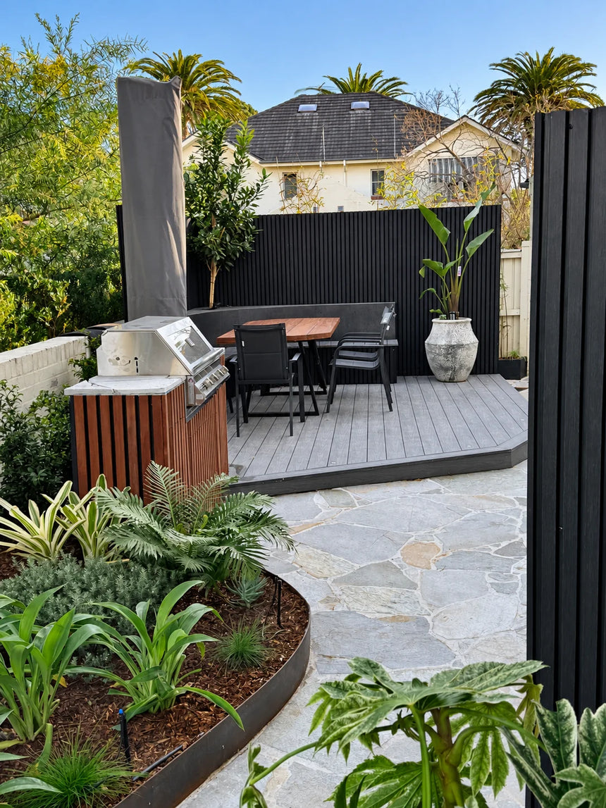 Mangolia crazy paving and garden beds beside a timber deck by Tilemall