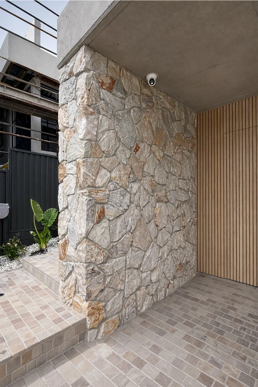 Sienna stone wall cladding around a covered entrance — matching walling finish reference for corners by Tilemall