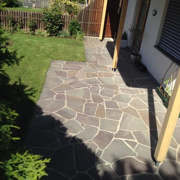 Porphyry crazy paving along a lawn-side garden path by Tilemall