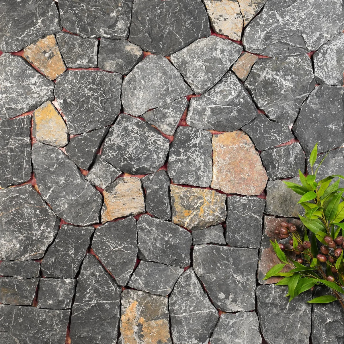 Yamuna organic walling with dark grey stone with rust-coloured accents by Tilemall