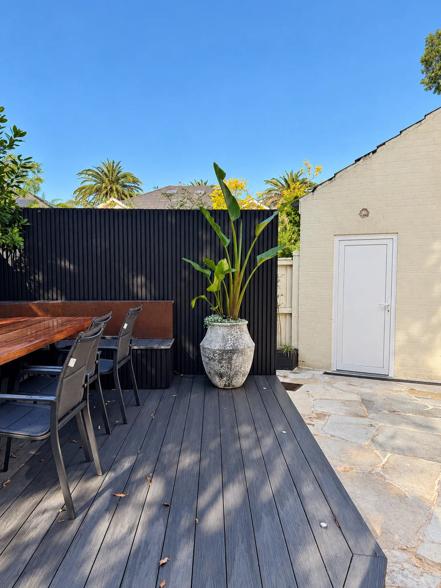 Mangolia crazy paving beside an outdoor timber deck by Tilemall
