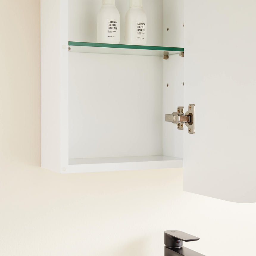 Close-up of Lukka Allison shaving cabinet interior with green glass shelf and soft-close hinge by Tilemall