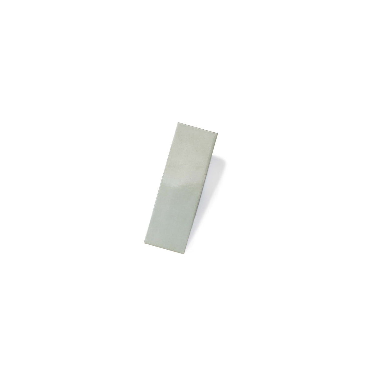 Mini 50x150mm gloss mint subway ceramic tile by Tilemall on neutral background