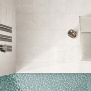 Monza 600x600mm cloud grip porcelain tiles installed on bathroom shower wall above mosaic floor by Tilemall