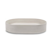 Nood Co Pill wall-hung basin by Tilemall, oval ivory stone composite 580x380mm