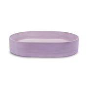 Nood Co Pill wall-hung basin by Tilemall in lilac, oval shape with curved rim, 580x380mm