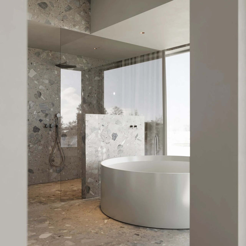 Sassi 600x600mm matt taupe terrazzo tiles installed on bathroom wall and floor with walk-in shower enclosure by Tilemall