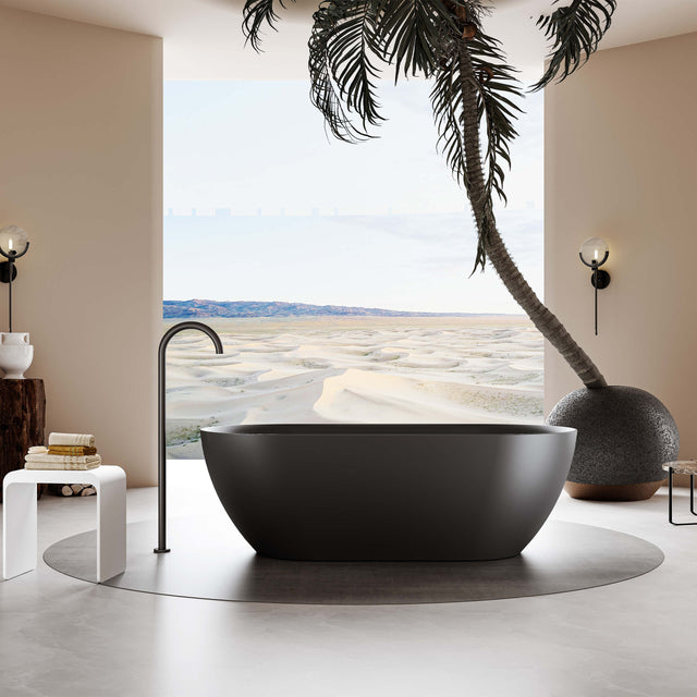 Ellips Slim freestanding acrylic bathtub by Tilemall in matt black, 1700mm, installed in bathroom interior