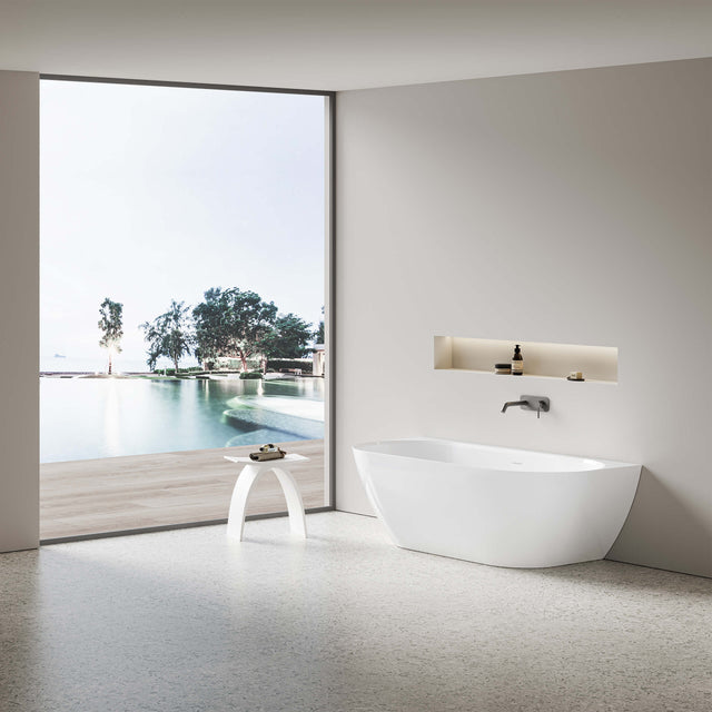 Ellips back-to-wall acrylic bathtub by Tilemall in matte white, 1700mm, installed in bathroom interior
