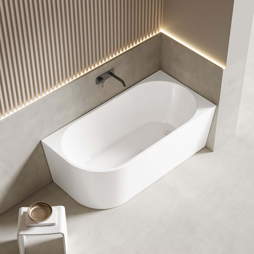 Bingie Lukka Corner Bath 1500mm gloss white installed in modern bathroom interior with black wall-mounted tap by Tilemall