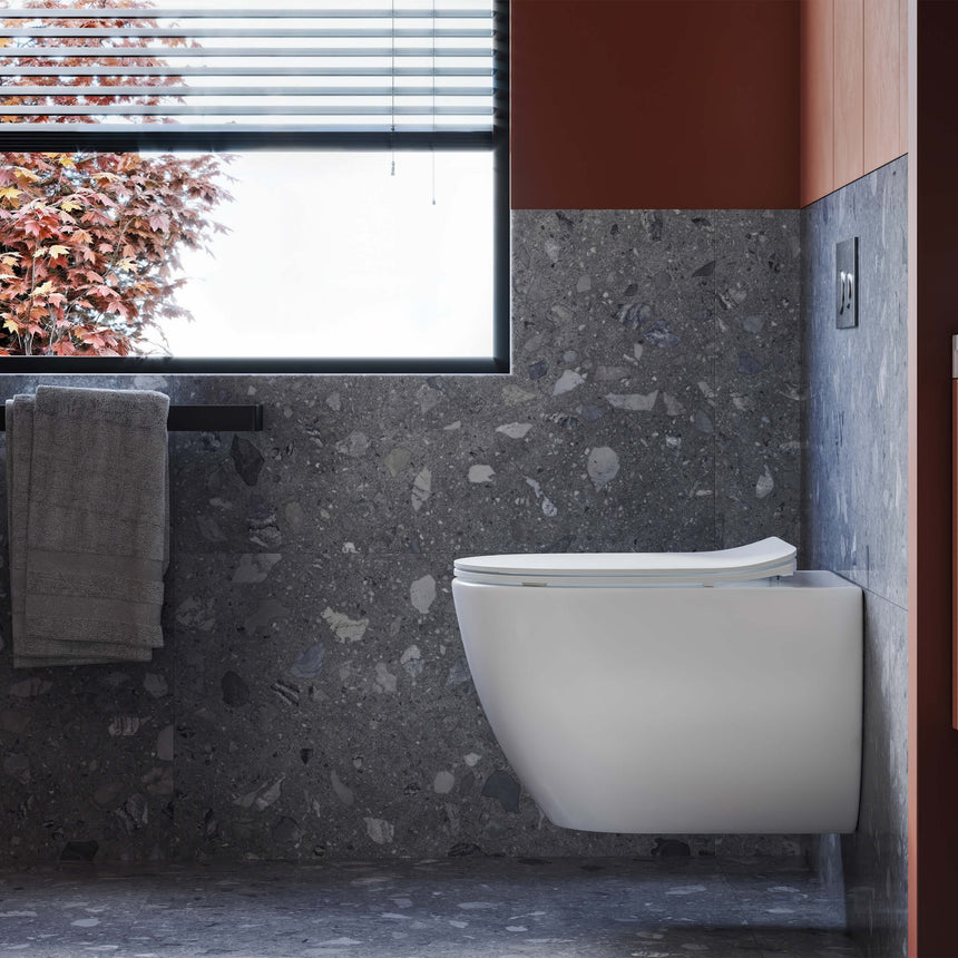 BelBagno Alexander-R wall-hung toilet installed in modern bathroom interior with dark stone tile and concrete walls by Tilemall