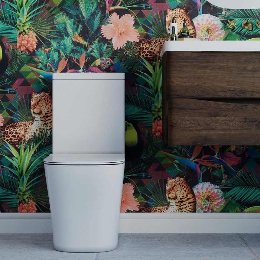 BelBagno Modena-R white toilet installed in bathroom interior with tropical wallpaper and dark wood vanity by Tilemall