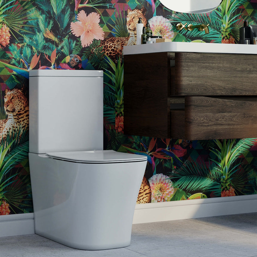 BelBagno Modena-R rimless toilet suite by Tilemall in gloss white, angled view in decorated bathroom
