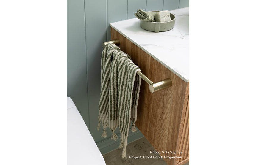 Phoenix Vivid Slimline Hand Towel Rail 350mm Brushed Gold, shown in a finished interior