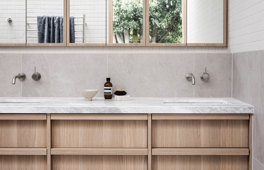 Phoenix Vivid Slimline Basin Outlet 230mm Curved Brushed Nickel, shown in a finished interior