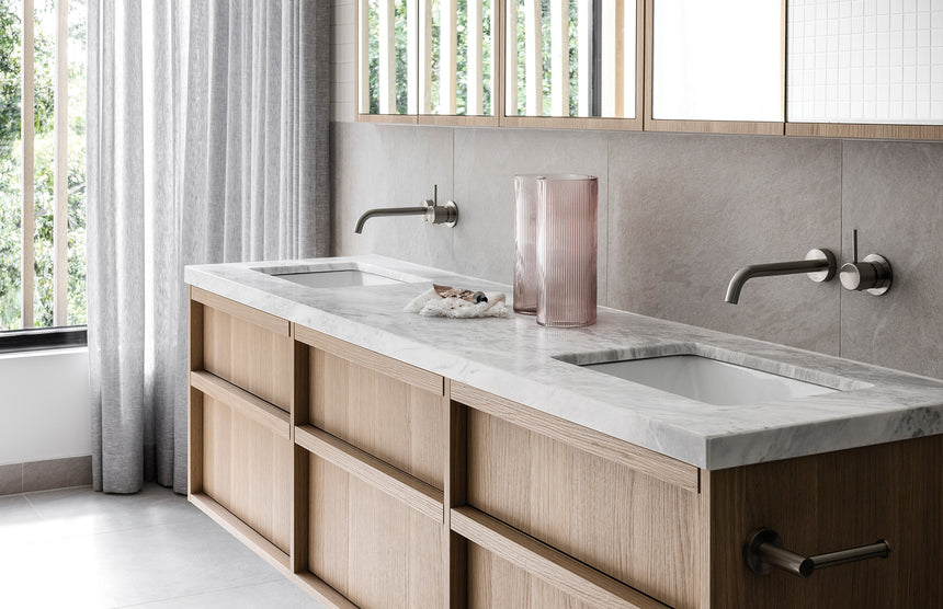 Phoenix Vivid Slimline Basin Outlet 230mm Curved Brushed Nickel, shown in a finished interior