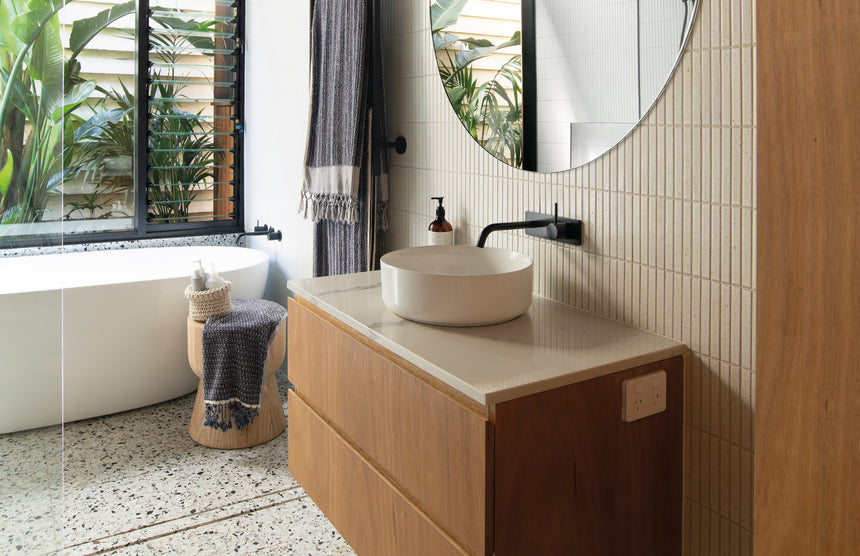 Phoenix Vivid Slimline Up Basin / Bath Wall Mixer Set Matte Black, shown in a finished interior