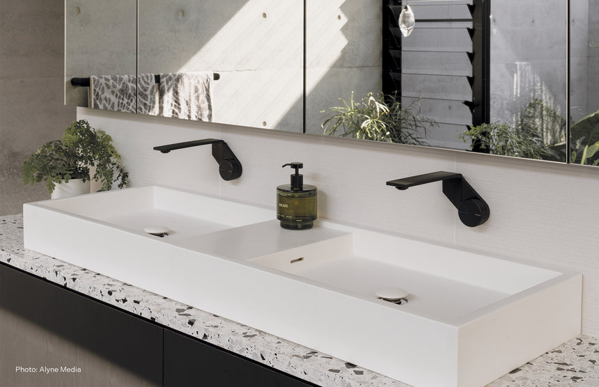 Phoenix Axia Wall Basin / Bath Mixer Set 200mm Matte Black, shown in a finished interior