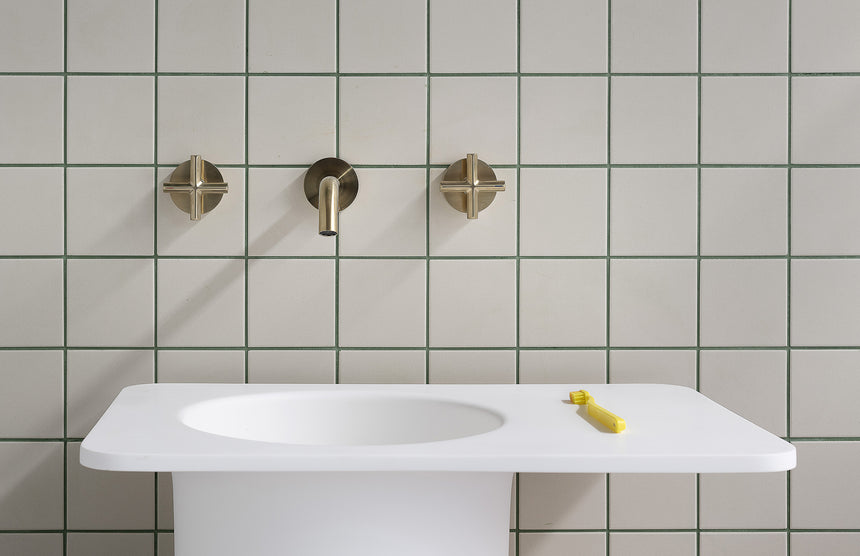 Phoenix Vivid Slimline Plus Wall Top Assemblies Brushed Gold, shown in a finished interior