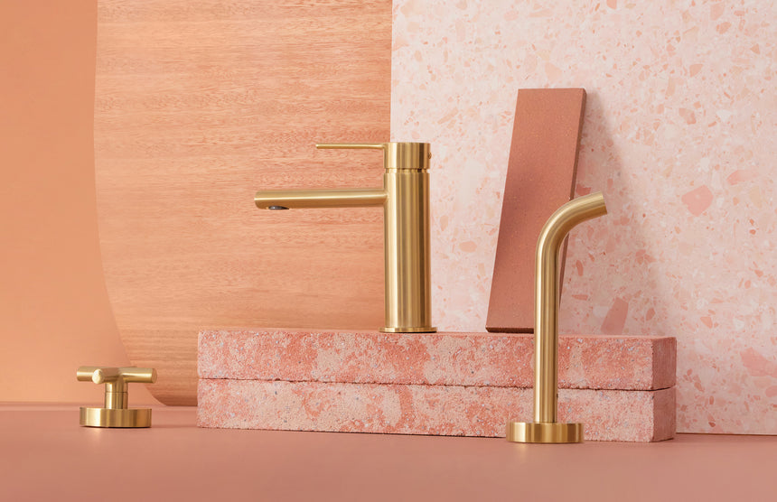Phoenix Vivid Slimline Plus Wall Top Assemblies Brushed Gold, shown in a finished interior