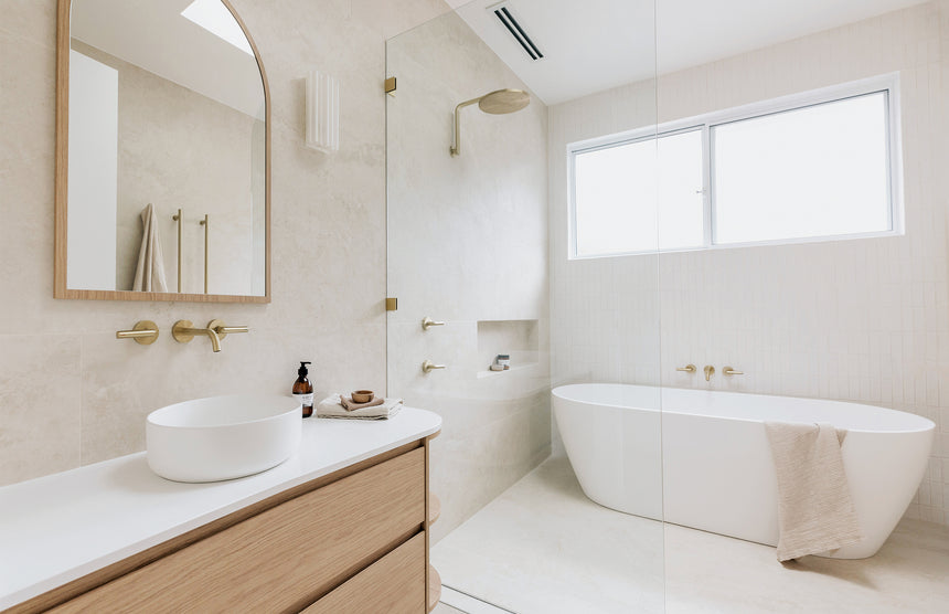 Phoenix Vivid Slimline Plus Wall Basin / Bath Outlet 180mm Brushed Gold, shown in a finished interior