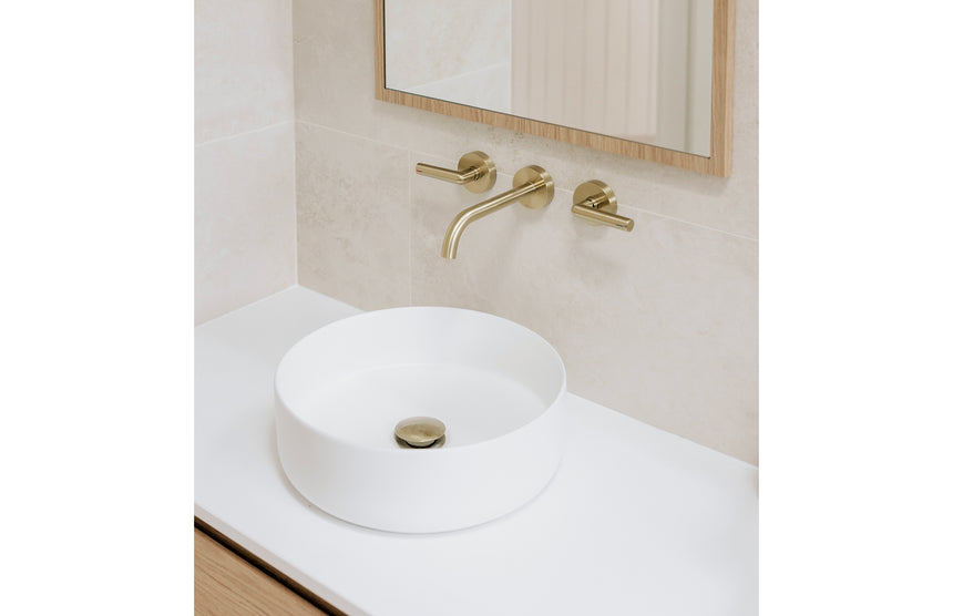 Phoenix Vivid Slimline Plus Wall Basin / Bath Outlet 180mm Brushed Gold, shown in a finished interior