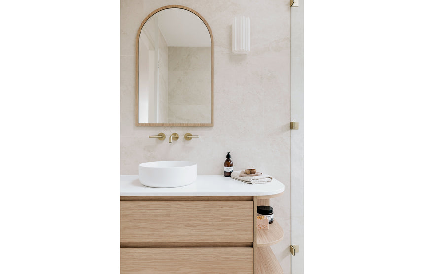 Phoenix Vivid Slimline Plus Wall Basin / Bath Outlet 180mm Brushed Gold, shown in a finished interior