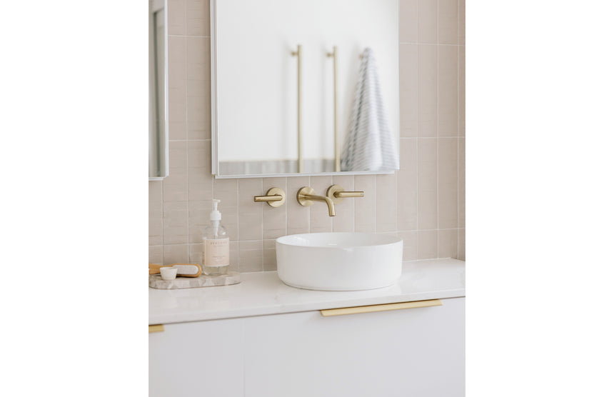 Phoenix Vivid Slimline Plus Wall Basin / Bath Outlet 180mm Brushed Gold, shown in a finished interior