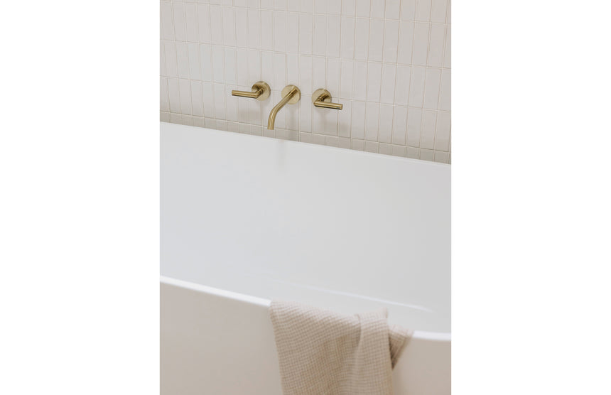 Phoenix Vivid Slimline Plus Wall Basin / Bath Outlet 180mm Brushed Gold, shown in a finished interior