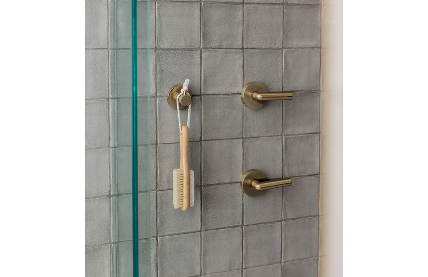Phoenix Vivid Slimline Plus Lever Wall Top Assemblies Brushed Gold, shown in a finished interior