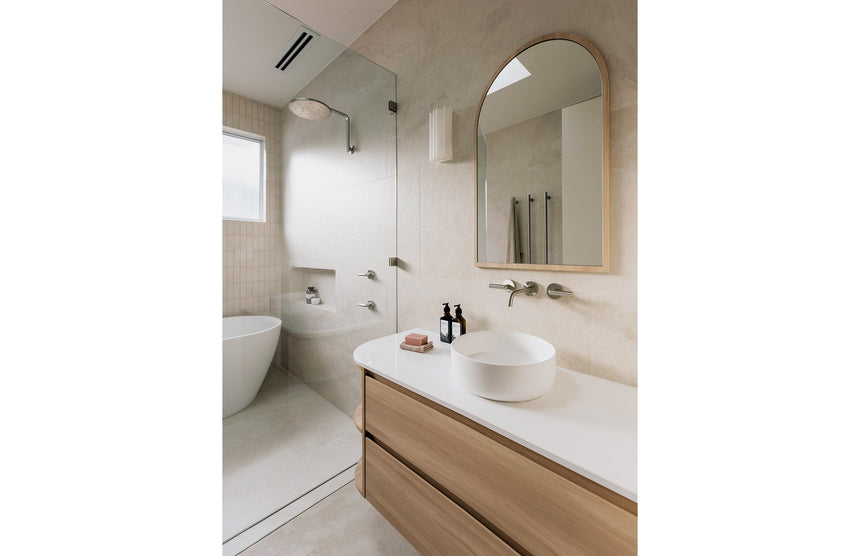 Phoenix Oxley High-Rise Shower Arm & Rose Brushed Nickel, shown in a finished interior