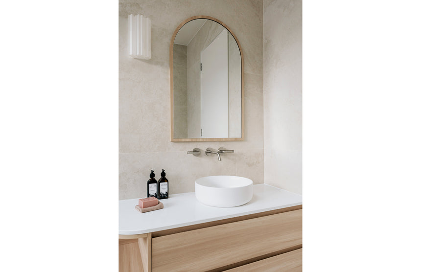 Phoenix Vivid Slimline Plus Wall Basin / Bath Outlet 180mm Brushed Nickel, shown in a finished interior