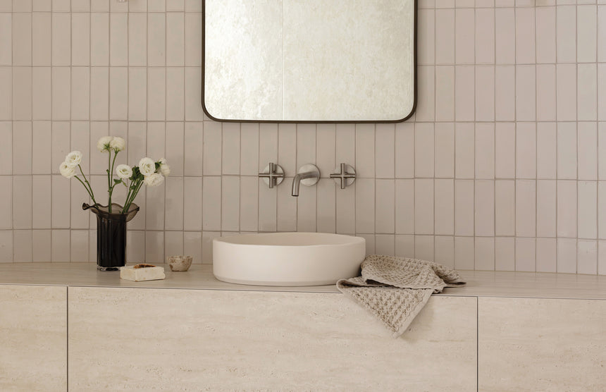 Phoenix Vivid Slimline Plus Wall Basin / Bath Outlet 180mm Brushed Nickel, shown in a finished interior