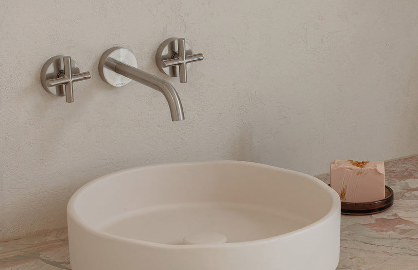 Phoenix Vivid Slimline Plus Wall Basin / Bath Outlet 180mm Brushed Nickel, shown in a finished interior