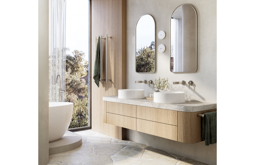 Phoenix Heated Triple Towel Rail Round 800mm Brushed Nickel, shown in a finished interior