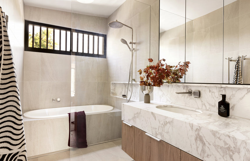 Phoenix Ormond Twin Shower Brushed Nickel, shown in a finished interior