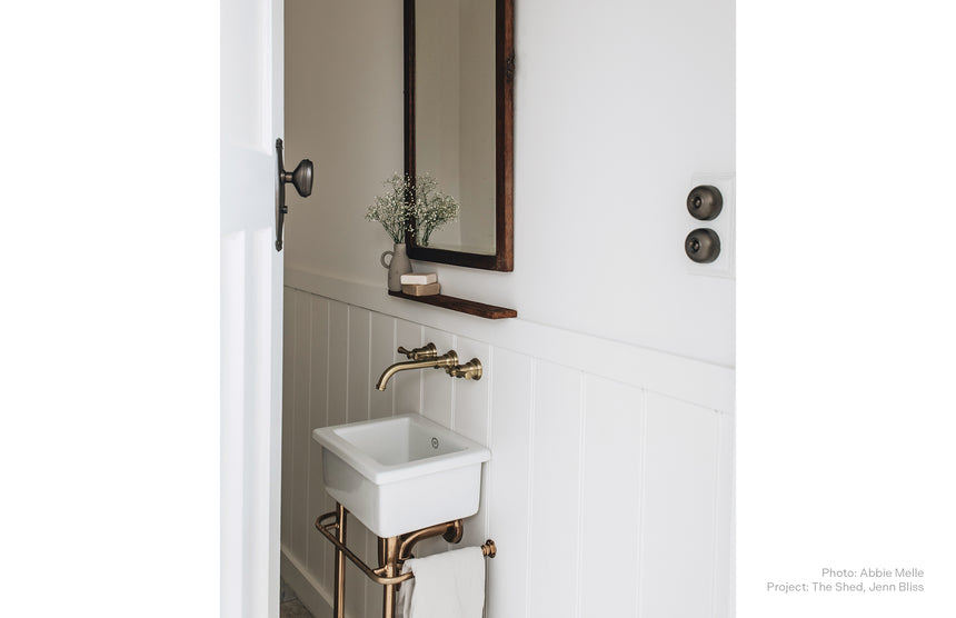 Phoenix Cromford Wall Basin / Bath Tap Set Brushed Gold, shown in a finished interior