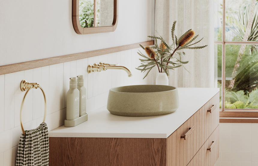 Phoenix Cromford Wall Basin / Bath Tap Set Brushed Gold, shown in a finished interior