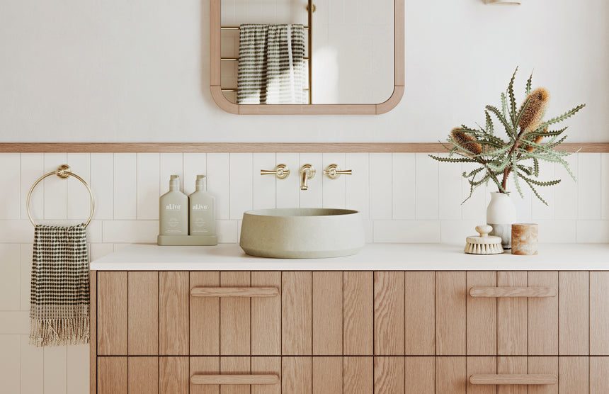 Phoenix Cromford Hand Towel Holder Brushed Gold, shown in a finished interior