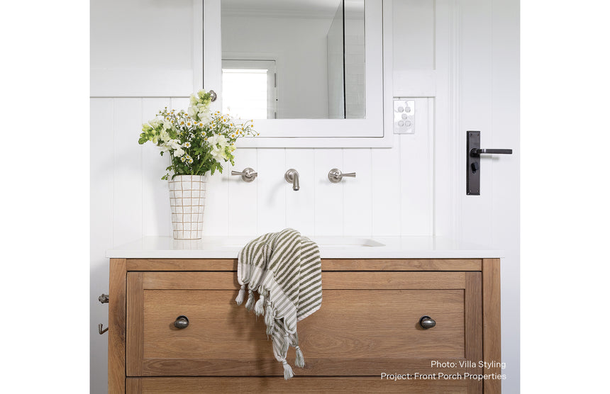Phoenix Cromford Wall Basin / Bath Tap Set Brushed Nickel, shown in a finished interior