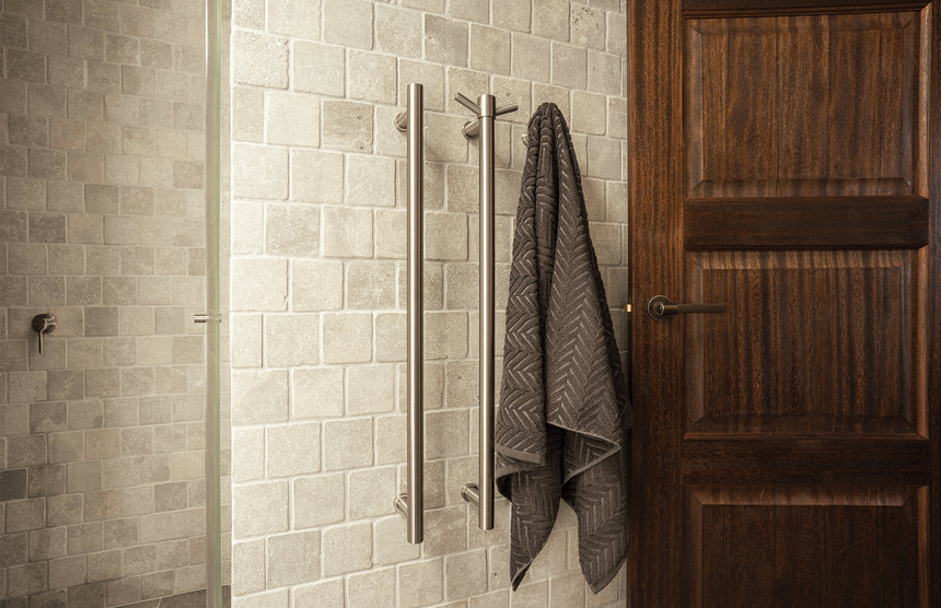 Phoenix Vertical Rail Hook Round Brushed Nickel, shown in a finished interior