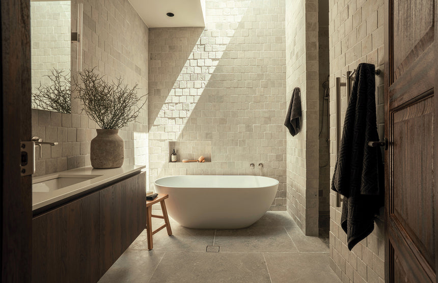 Phoenix Heated Triple Towel Rail Round 800mm Brushed Nickel, shown in a finished interior