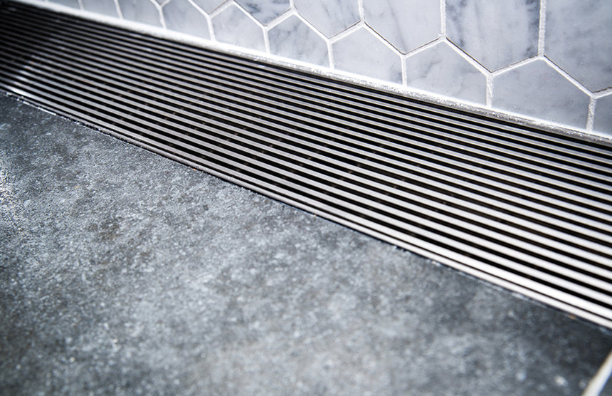 Phoenix Flat Channel Drain HG 75 x 600mm Outlet 45mm Stainless Steel, shown in a finished interior