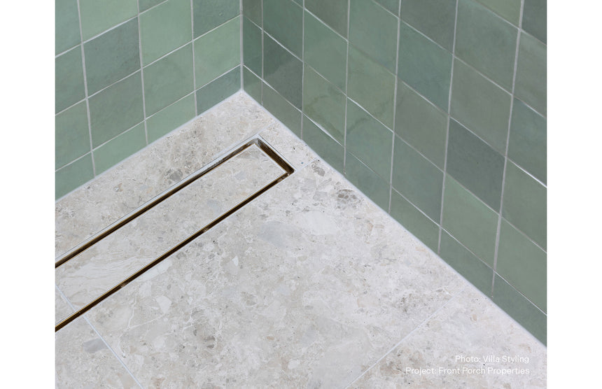 Phoenix V Channel Drain TI 100 x 750mm Outlet 90mm Stainless Steel, shown in a finished interior