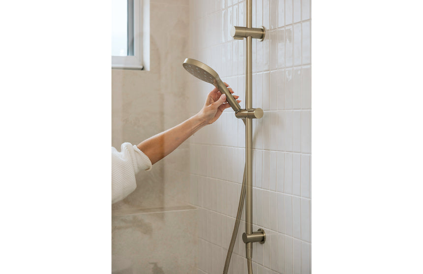 Phoenix Ormond Twin Shower Brushed Gold, shown in a finished interior