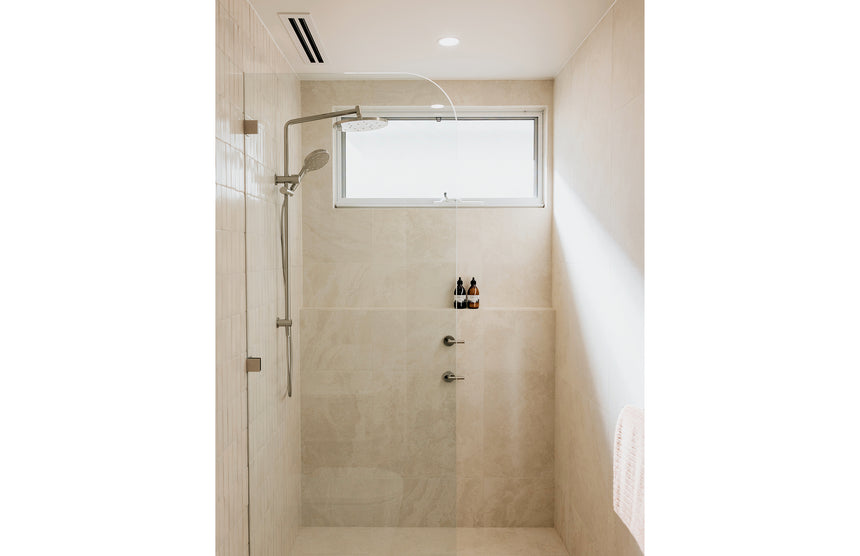 Phoenix Ormond Twin Shower Brushed Nickel, shown in a finished interior