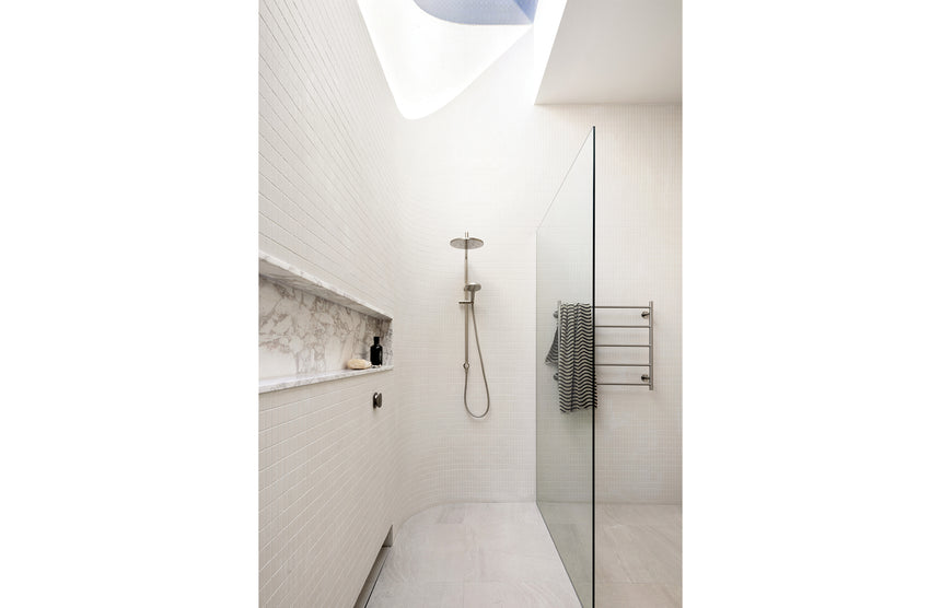 Phoenix Ormond Twin Shower Brushed Nickel, shown in a finished interior