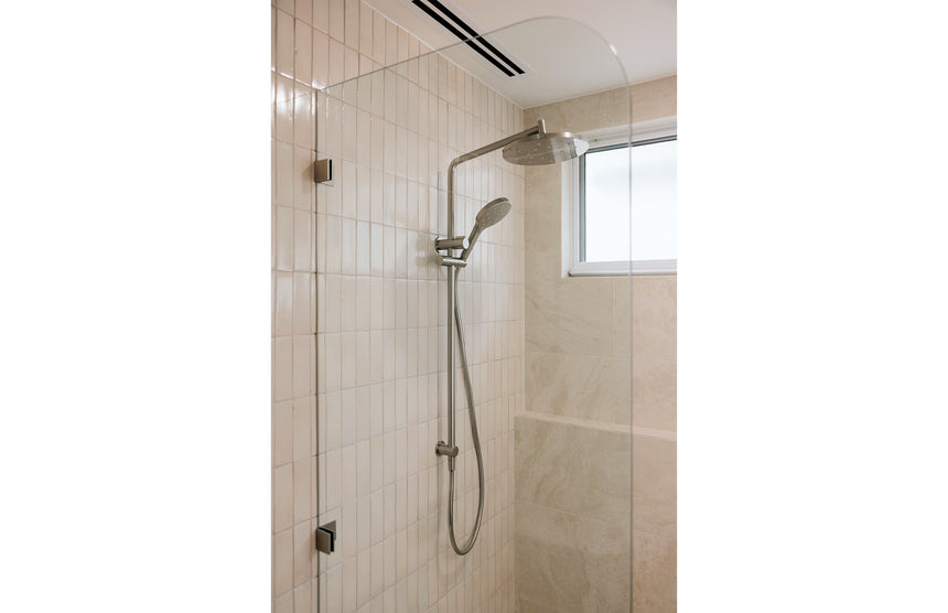 Phoenix Ormond Twin Shower Brushed Nickel, shown in a finished interior