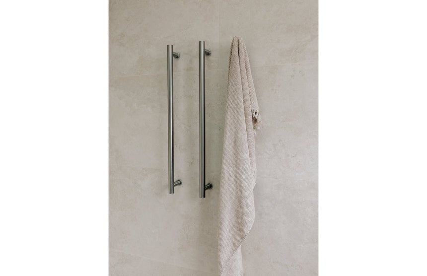 Phoenix Heated Triple Towel Rail Round 800mm Brushed Nickel, shown in a finished interior